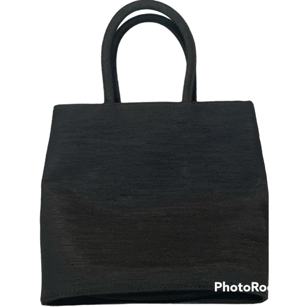 Cute Ann Taylor handbag in black satin with snap closure.‎